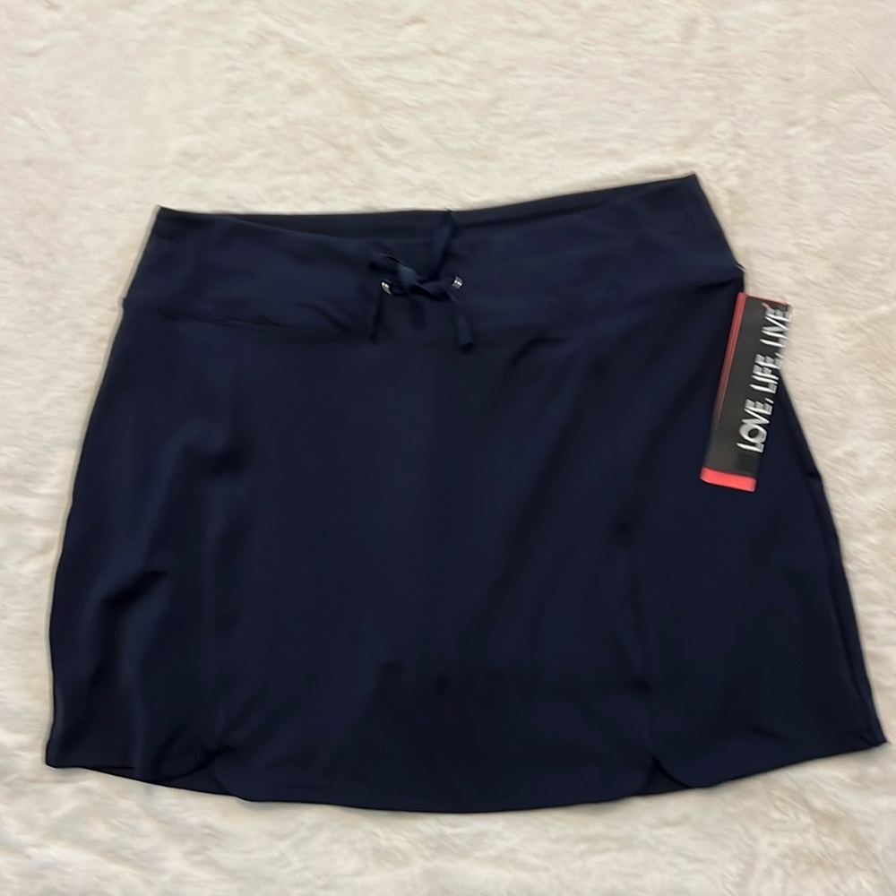 Activewear skirt with shorts attached, fits above knees